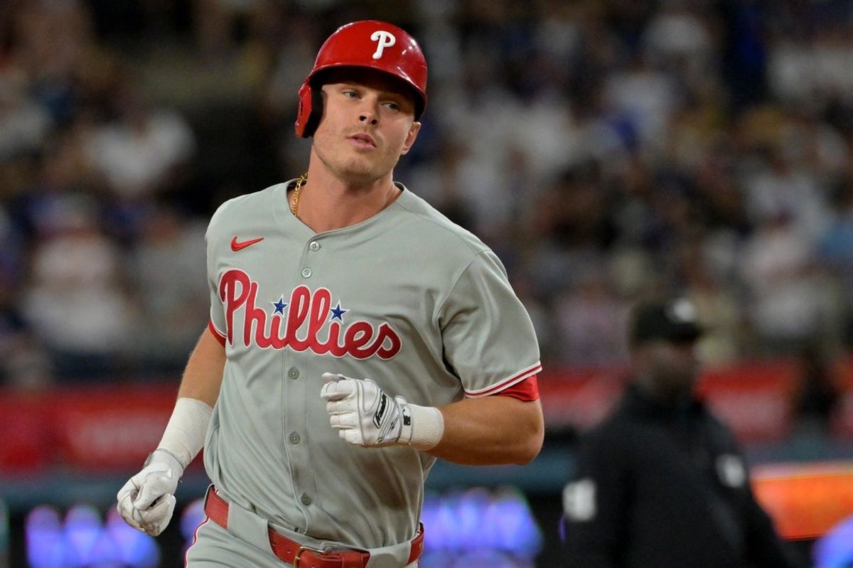 Sep 16, 2025; Los Angeles, California, USA;  Philadelphia Phillies left fielder Max Kepler (17) hits a solo home run during the seventh inning against the Los Angeles Dodgers at Dodger Stadium. Mandatory Credit: Jayne Kamin-Oncea-Imagn Images