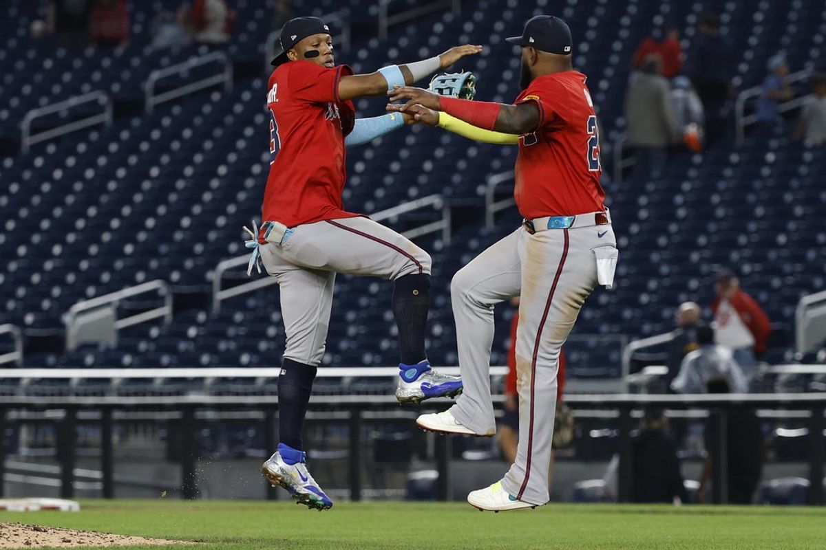 Sep 17, 2025; Washington, District of Columbia, USA; Atlanta Braves outfielder Ronald Acuña Jr. (13) celebrates with Braves designated hitter Marcell Ozuna (20) after their game against the Washington Nationals at Nationals Park. Mandatory Credit: Geoff Burke-Imagn Images
