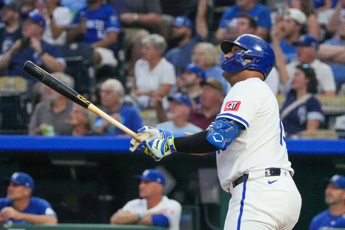 Sep 17, 2025; Kansas City, Missouri, USA; Kansas City Royals catcher Salvador Perez (13) hits a three run home run against the Seattle Mariners during the first inning at Kauffman Stadium. Mandatory Credit: Denny Medley-Imagn Images