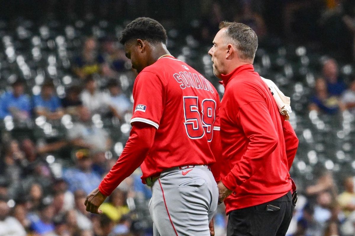 Sep 17, 2025; Milwaukee, Wisconsin, USA;  Los Angeles Angels starting pitcher Jose Soriano (59) leaves the game after getting hit by a batted ball in the second inning against the Milwaukee Brewers at American Family Field. Mandatory Credit: Benny Sieu-Imagn Images