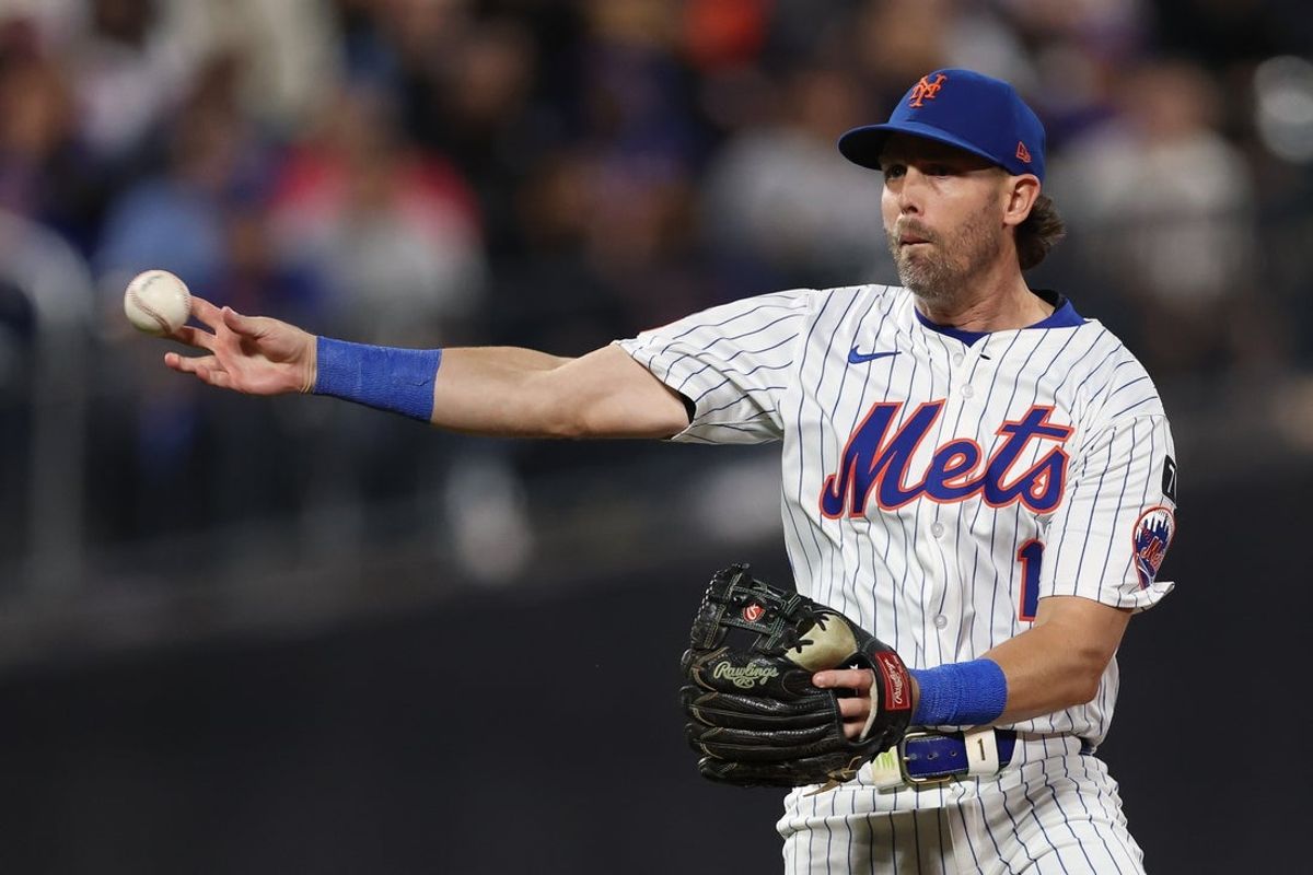 Sep 17, 2025; New York City, New York, USA; New York Mets second baseman Jeff McNeil (1) throws the ball to first base for an out during the sixth inning against the San Diego Padres at Citi Field. Mandatory Credit: Vincent Carchietta-Imagn Images