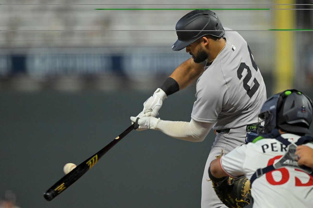 Sep 17, 2025; Minneapolis, Minnesota, USA;  New York Yankees outfielder Jasson Dominguez (24) hits a RBI double against the Minnesota Twins during the third inning at Target Field. Mandatory Credit: Nick Wosika-Imagn Images