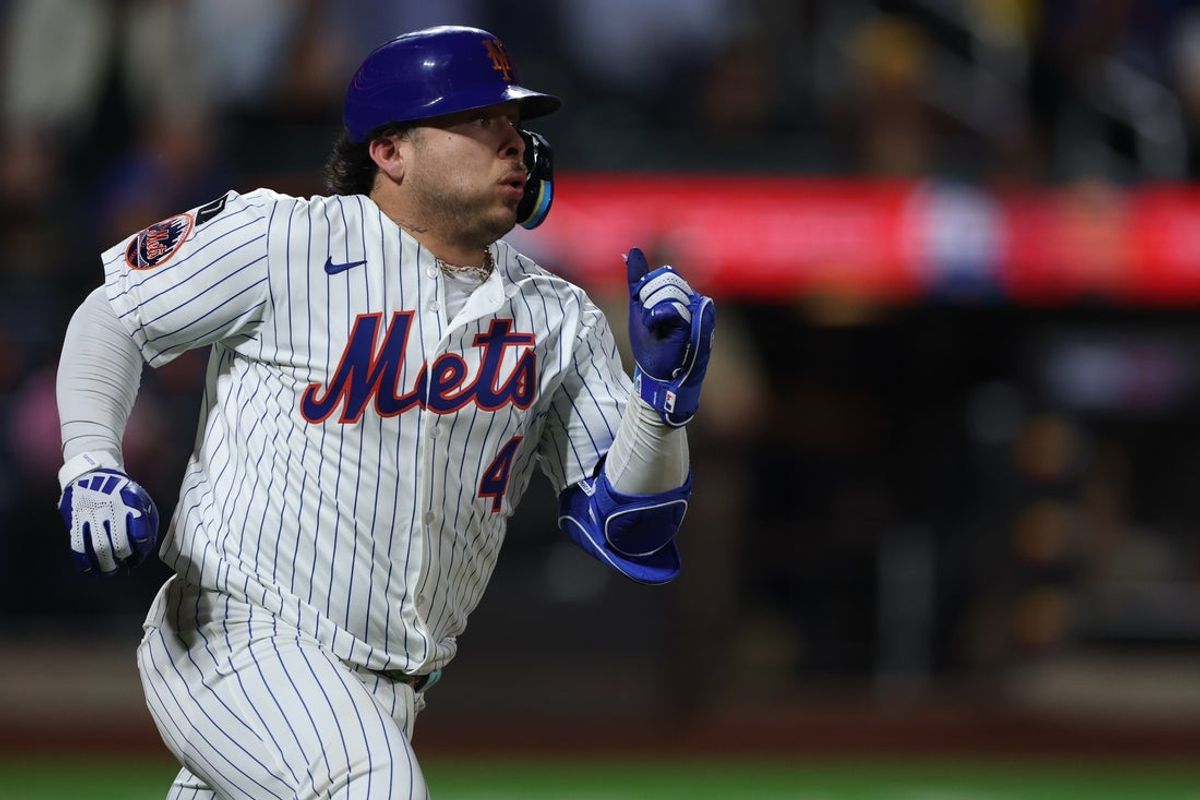 Sep 17, 2025; New York City, New York, USA; New York Mets catcher Francisco Alvarez (4) hits a solo home run during the seventh inning against the San Diego Padres at Citi Field. Mandatory Credit: Vincent Carchietta-Imagn Images