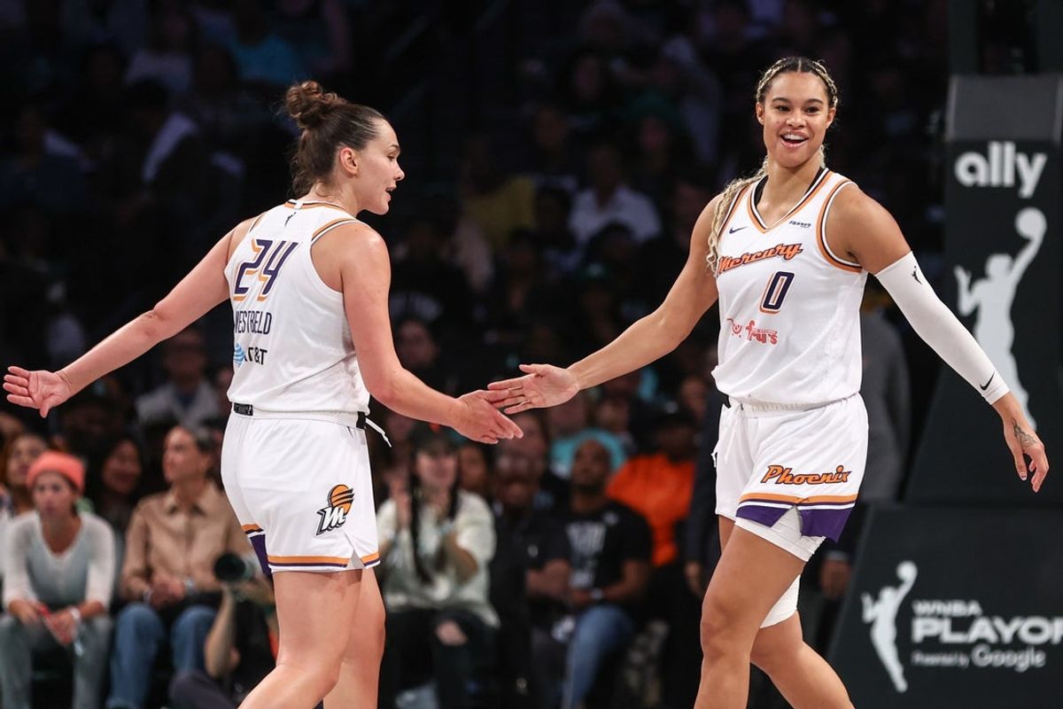 Sep 17, 2025; Brooklyn, New York, USA; Phoenix Mercury forward Kathryn Westbeld (24) and Phoenix Mercury forward Satou Sabally (0) celebrate after the New York Liberty call a timeout during game two of round one for the 2025 WNBA Playoffs at Barclays Center. Mandatory Credit: Wendell Cruz-Imagn Images