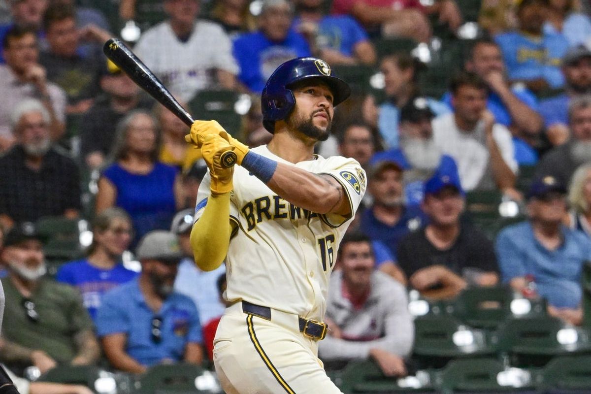 Sep 17, 2025; Milwaukee, Wisconsin, USA; Milwaukee Brewers center fielder Blake Perkins (16) hits a triple to drive in three runs in the eighth inning against the Los Angeles Angels at American Family Field. Mandatory Credit: Benny Sieu-Imagn Images
