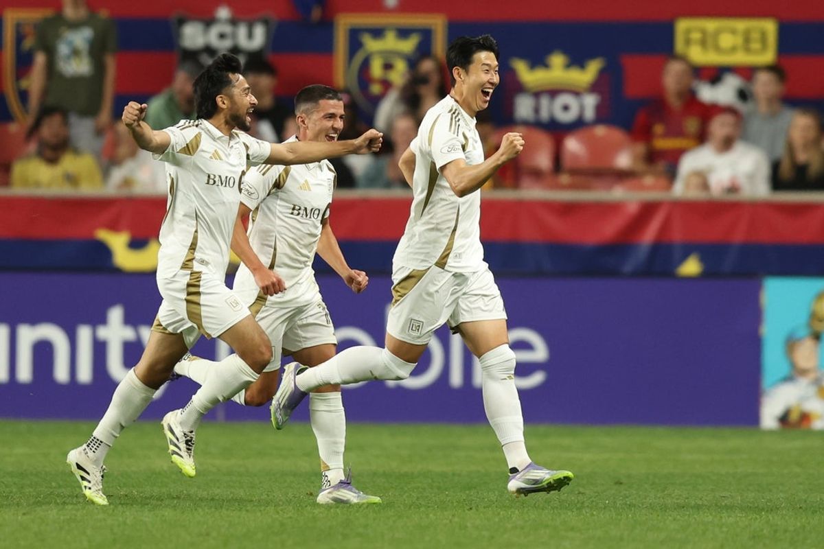 Sep 17, 2025; Sandy, Utah, USA; Los Angeles FC forward Son Heung-Min (right) reacts to scoring a goal against Real Salt Lake during the first half at America First Field. Mandatory Credit: Rob Gray-Imagn Images