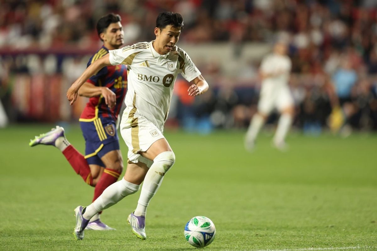 Sep 17, 2025; Sandy, Utah, USA; Los Angeles FC forward Son Heung-Min (7) brings the ball up the field against Real Salt Lake defender Brayan Vera (4) during the second half at America First Field. Mandatory Credit: Rob Gray-Imagn Images