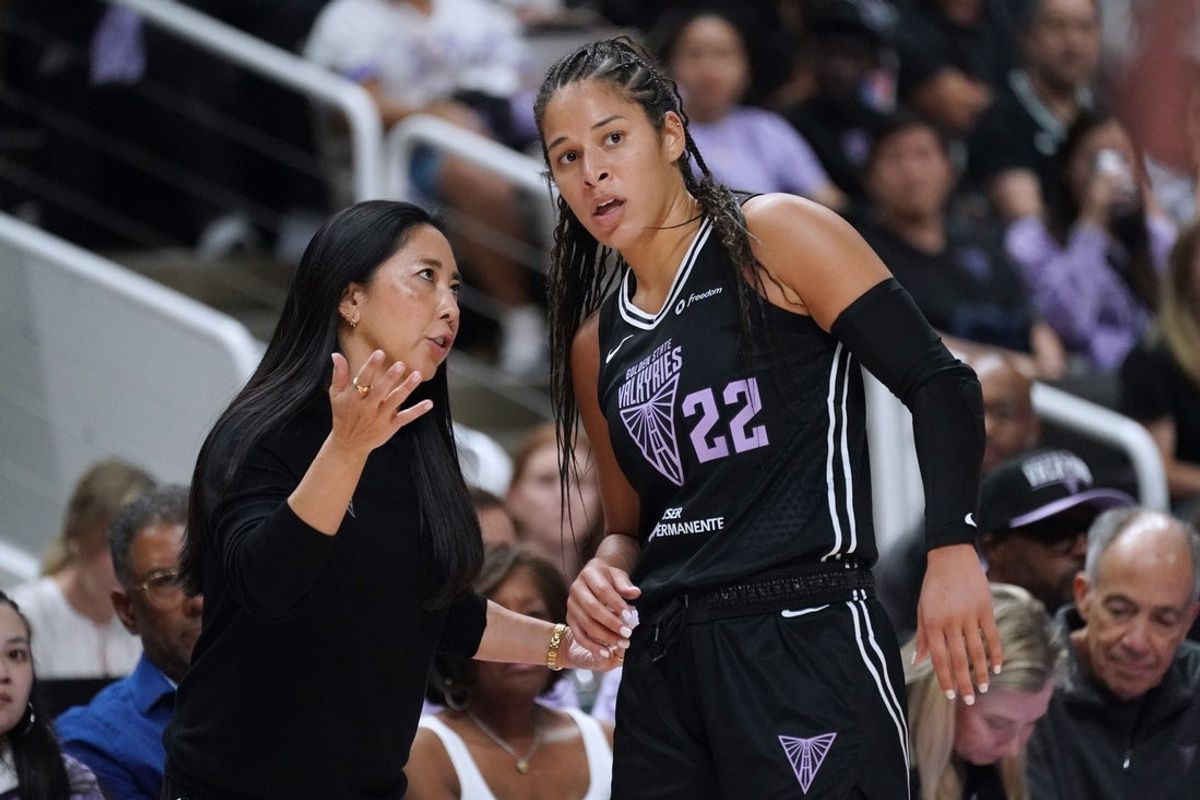Sep 17, 2025; San Jose, California, USA; Golden State Valkyries head coach Natalie Nakase talks with guard Veronica Burton (22) in the fourth quarter against the Minnesota Lynx in game two of round one for the 2025 WNBA Playoffs at SAP Center. Mandatory Credit: David Gonzales-Imagn Images