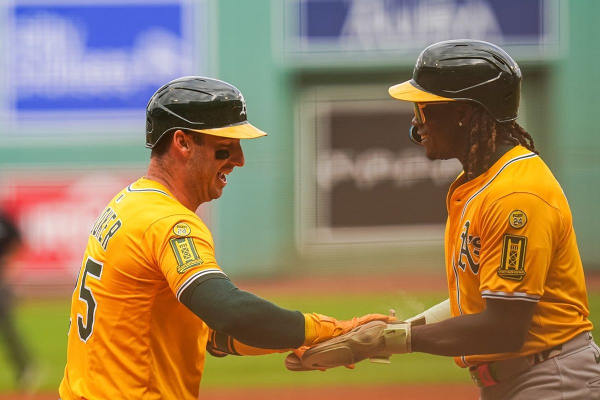 Sep 18, 2025; Boston, Massachusetts, USA; Athletics designated hitter Brent Rooker (25) reacts with Athletics outfielder Lawrence Butler (4) after hitting a two run home run against the Boston Red Sox in the first inning at Fenway Park. Mandatory Credit: David Butler II-Imagn Images