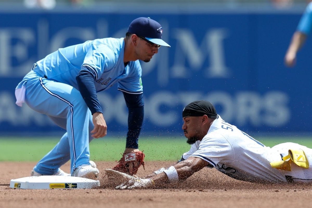 Sep 18, 2025; Tampa, Florida, USA; Tampa Bay Rays center fielder Chandler Simpson (14) slides into second base on a double against the Toronto Blue Jays in the first inning at George M. Steinbrenner Field. Mandatory Credit: Nathan Ray Seebeck-Imagn Images