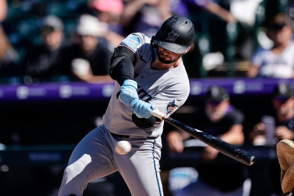 Sep 18, 2025; Denver, Colorado, USA; Miami Marlins designated hitter Liam Hicks (34) hits a two RBI single in the seventh inning against the Colorado Rockies at Coors Field. Mandatory Credit: Isaiah J. Downing-Imagn Images