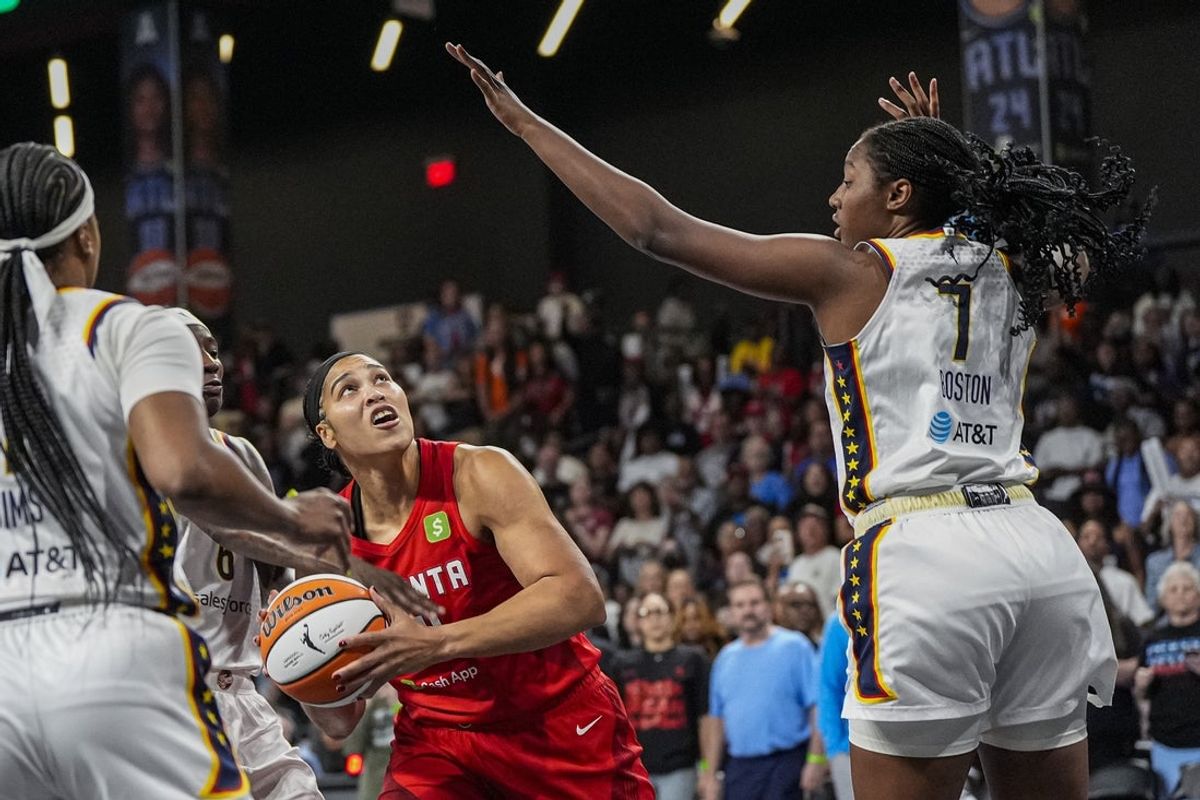 Sep 18, 2025; College Park, Georgia, USA; Atlanta Dream forward Brionna Jones (24) looks to shoot against Indiana Fever forward Aliyah Boston (7) during the first half during game three of round one for the 2025 WNBA Playoffs at Gateway Center Arena at College Park. Mandatory Credit: Dale Zanine-Imagn Images