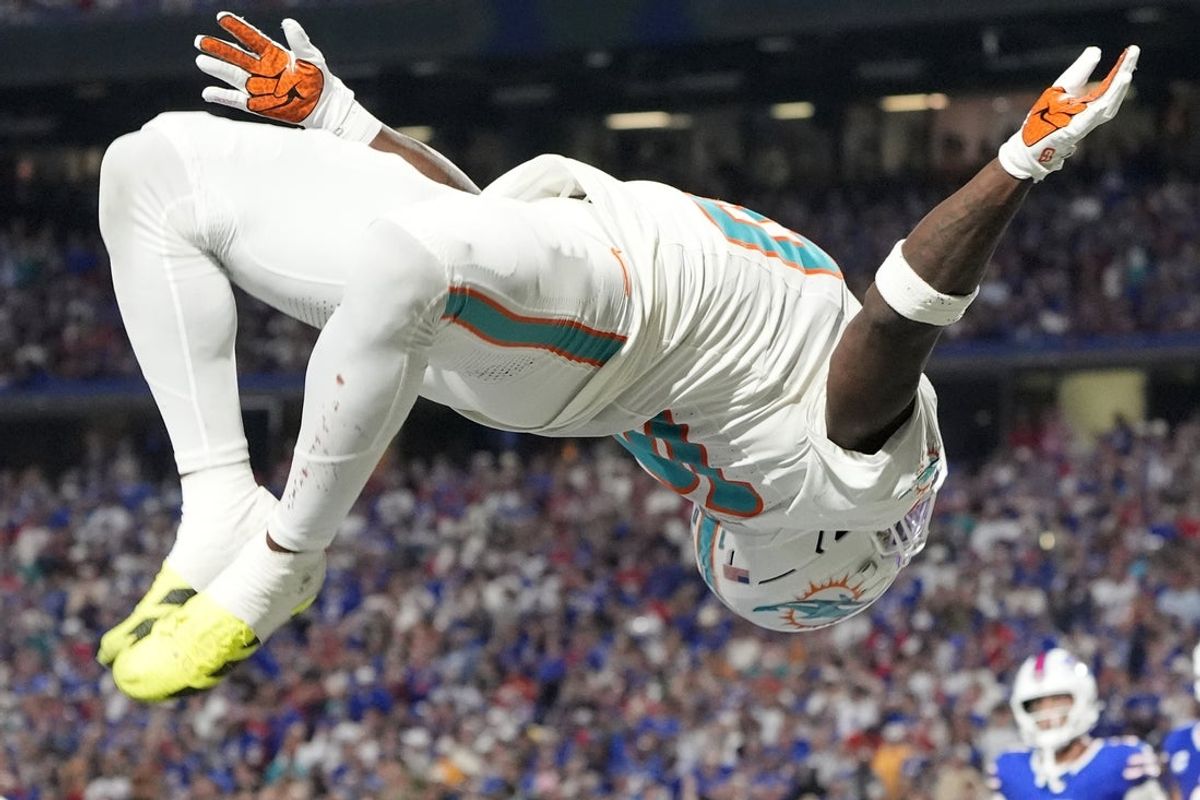 Sep 18, 2025; Orchard Park, New York, USA;  Miami Dolphins wide receiver Tyreek Hill (10) celebrates after scoring a touchdown against the Buffalo Bills in the fourth quarter at Highmark Stadium. Mandatory Credit: Gregory Fisher-Imagn Images