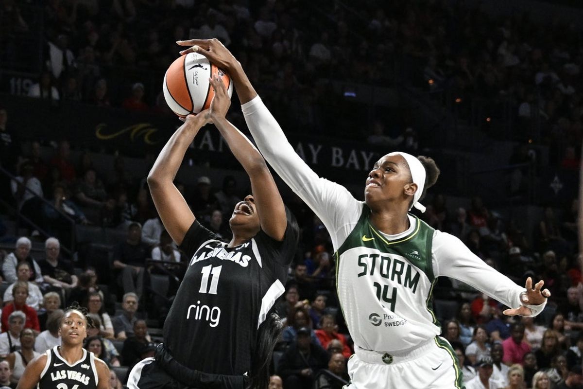 Sep 18, 2025; Las Vegas, Nevada, USA; Seattle Storm center Dominique Malonga (14) blocks a shot from Las Vegas Aces guard Dana Evans (11) in the first quarter during game three of round one for the 2025 WNBA Playoffs at Michelob Ultra Arena. Mandatory Credit: Candice Ward-Imagn Images