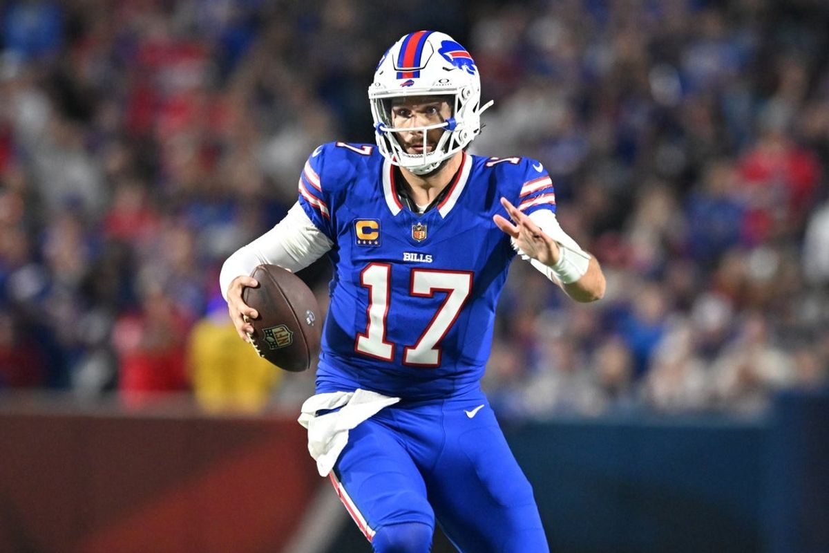 Sep 18, 2025; Orchard Park, New York, USA; Buffalo Bills quarterback Josh Allen (17) runs against the Miami Dolphins in the second half at Highmark Stadium. Mandatory Credit: Mark Konezny-Imagn Images