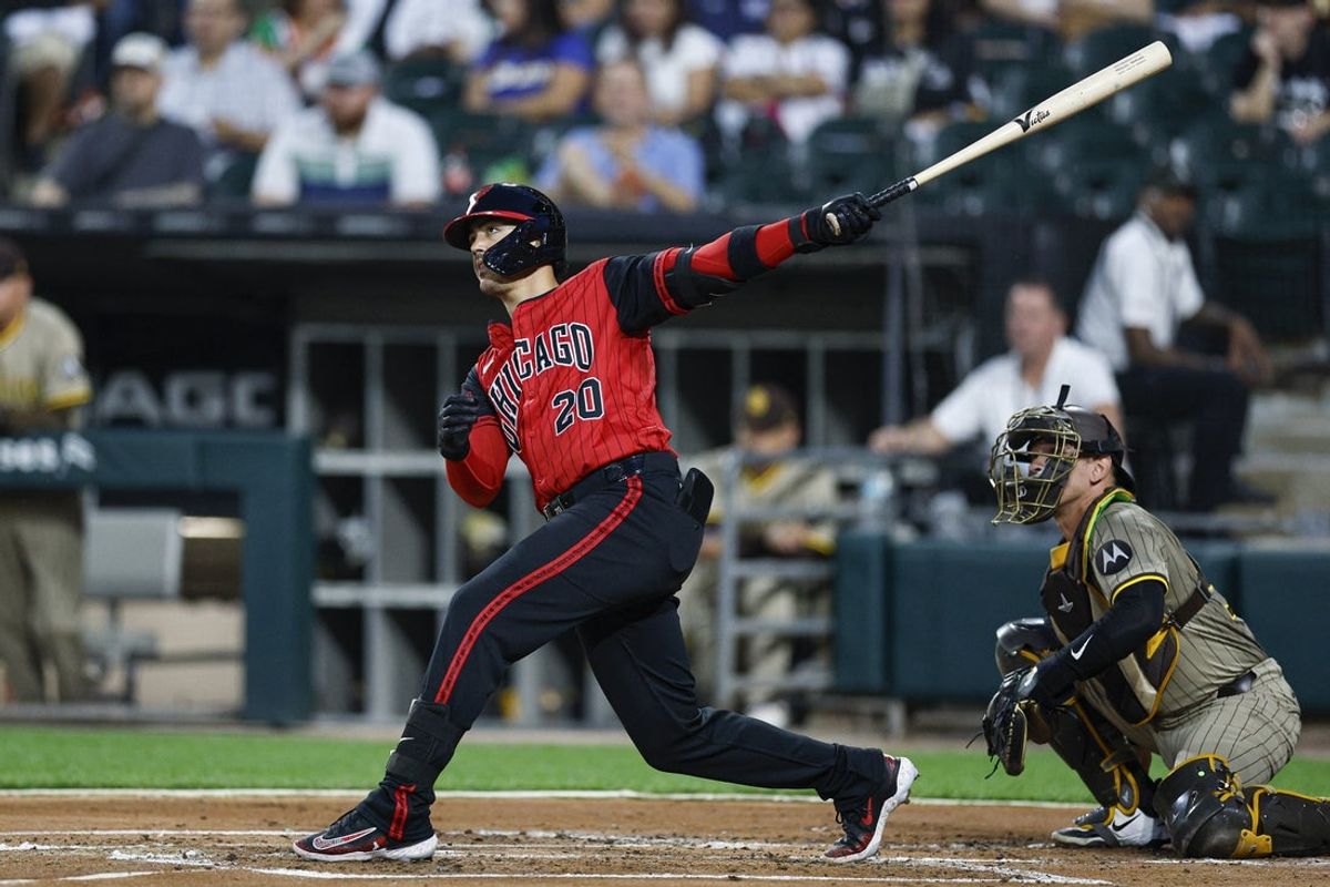 Sep 19, 2025; Chicago, Illinois, USA; Chicago White Sox first baseman Miguel Vargas (20) hits a two-run home run against the San Diego Padres during the first inning at Rate Field. Mandatory Credit: Kamil Krzaczynski-Imagn Images