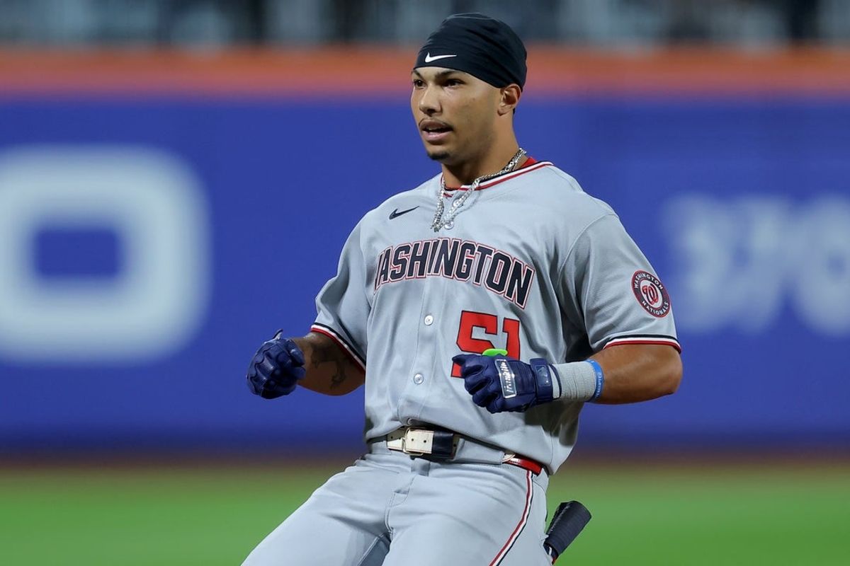 Sep 19, 2025; New York City, New York, USA; Washington Nationals designated hitter Daylen Lile (51) reacts as he reaches third base after hitting an RBI triple against the New York Mets during the third inning at Citi Field. Mandatory Credit: Brad Penner-Imagn Images
