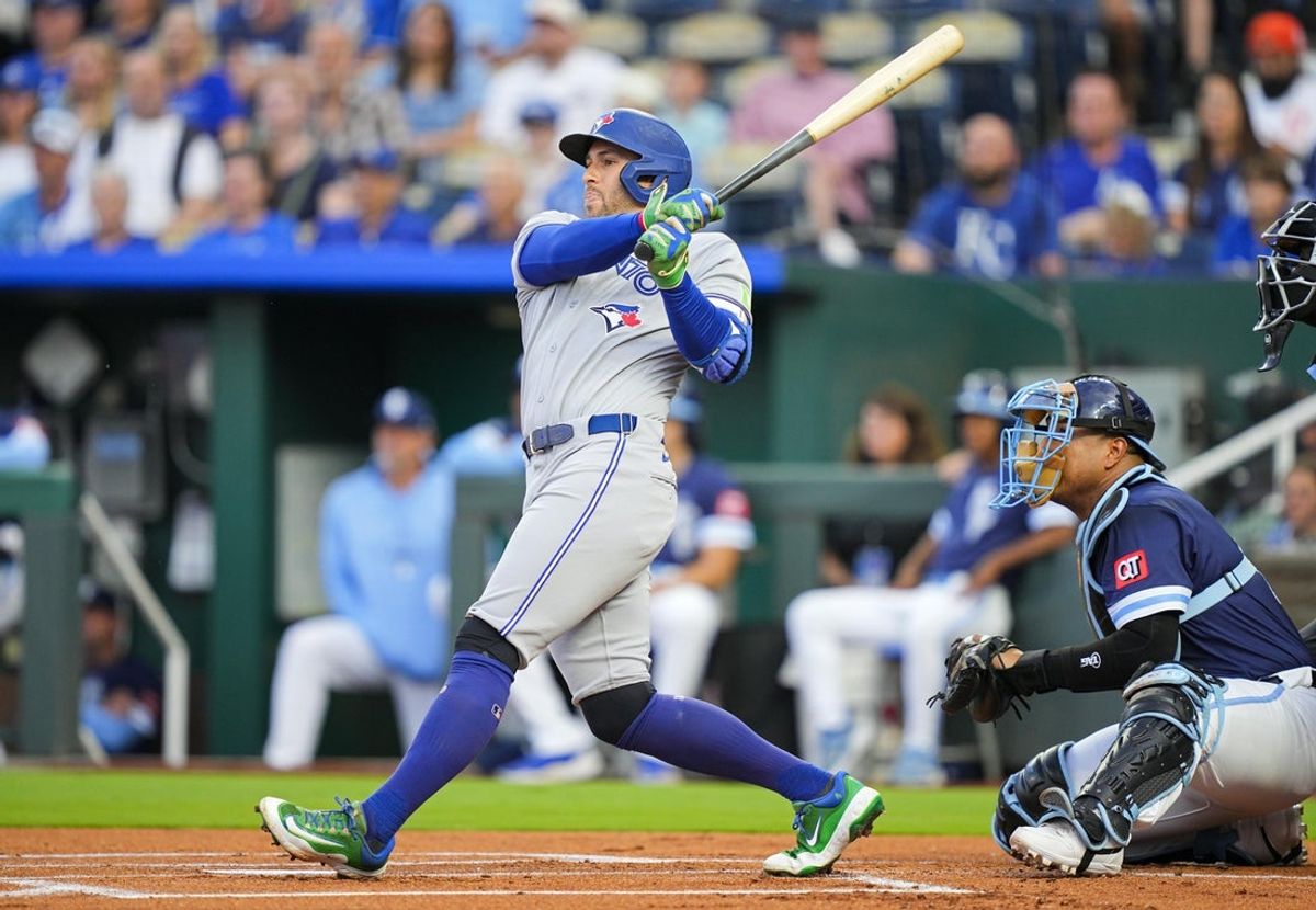 Sep 19, 2025; Kansas City, Missouri, USA; Toronto Blue Jays designated hitter George Springer (4) hits a home run during the first inning against the Kansas City Royals at Kauffman Stadium. Mandatory Credit: Jay Biggerstaff-Imagn Images