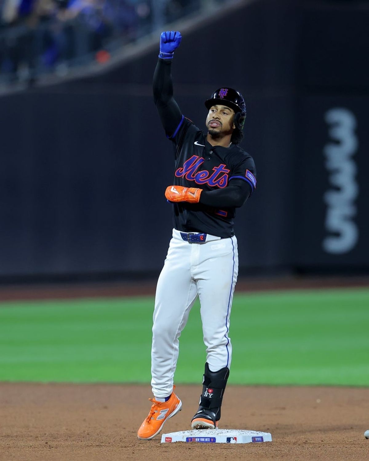 Sep 19, 2025; New York City, New York, USA; New York Mets shortstop Francisco Lindor (12) reacts after hitting an RBI single against the Washington Nationals during the fourth inning at Citi Field. Lindor advanced to second base on an error by Nationals left fielder James Wood (not pictured). Mandatory Credit: Brad Penner-Imagn Images