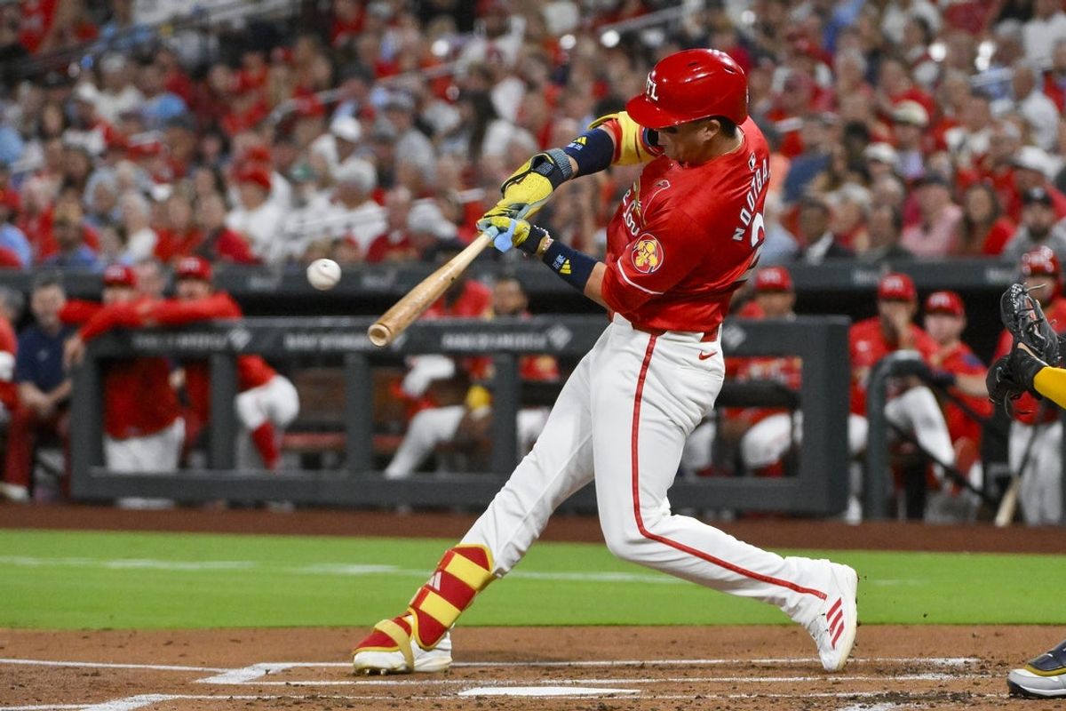 Sep 19, 2025; St. Louis, Missouri, USA;  St. Louis Cardinals left fielder Lars Nootbaar (21) hits a one run single against the Milwaukee Brewers during the first inning at Busch Stadium. Mandatory Credit: Jeff Curry-Imagn Images
