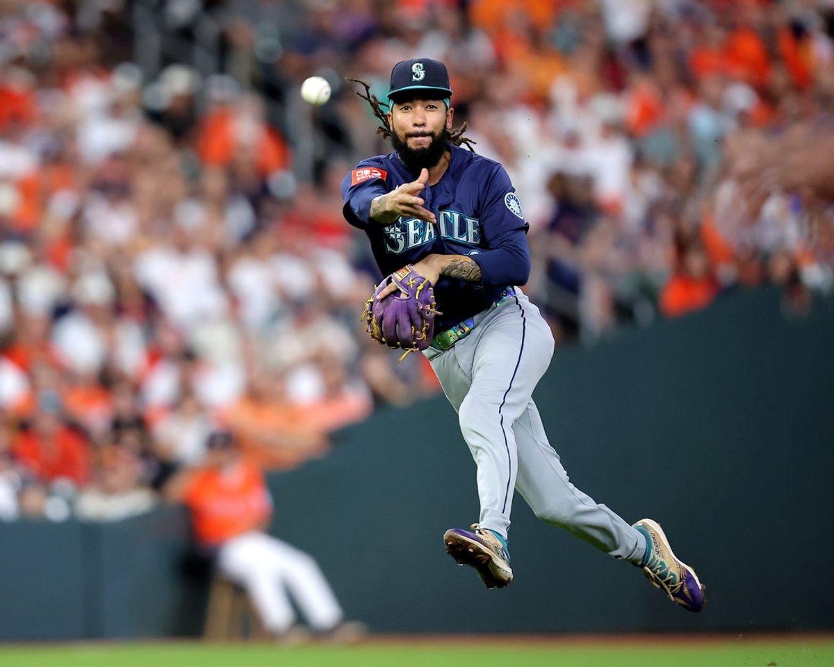 Sep 19, 2025; Houston, Texas, USA; Seattle Mariners shortstop J.P. Crawford (3) throws a fielded ball to first base for an out against the Houston Astros during the fourth inning at Daikin Park. Mandatory Credit: Erik Williams-Imagn Images