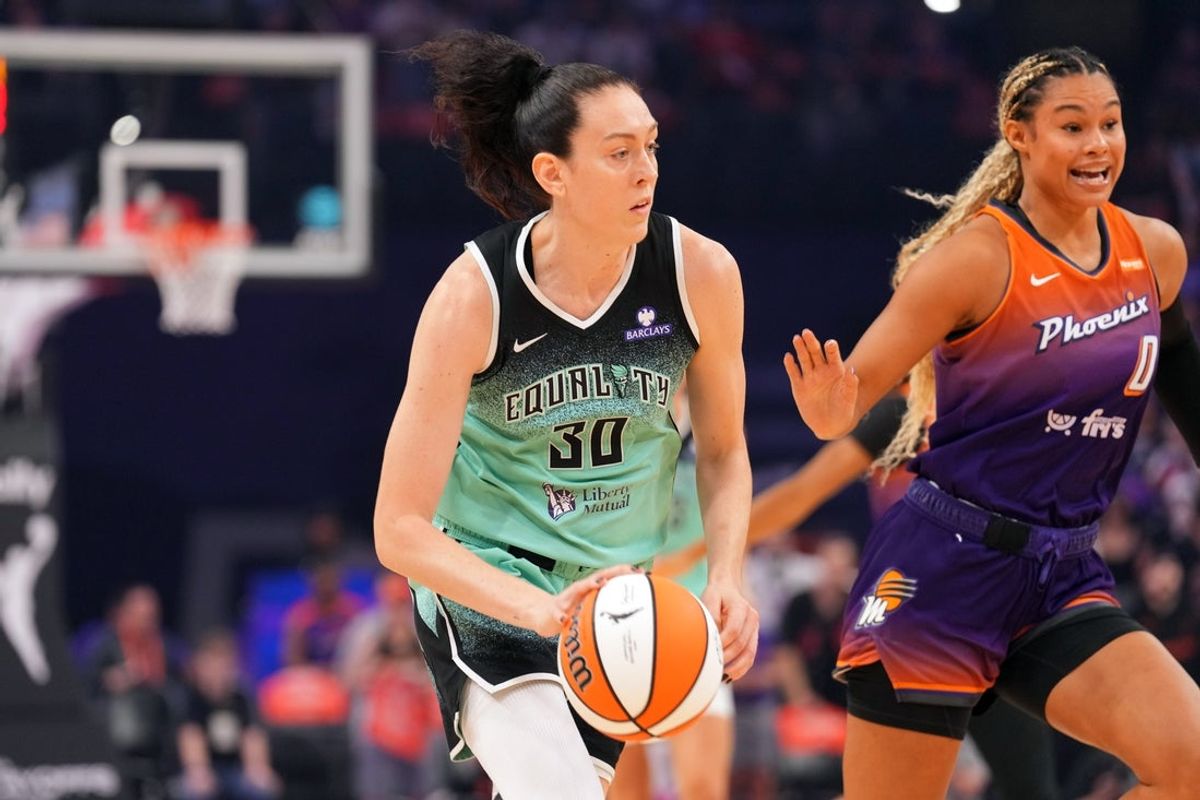 Sep 19, 2025; Phoenix, Arizona, USA; New York Liberty forward Breanna Stewart (30) dribbles by Phoenix Mercury forward Satou Sabally (0) during the first half of game three of round one for the 2025 WNBA Playoffs at PHX Arena. Mandatory Credit: Joe Camporeale-Imagn Images
