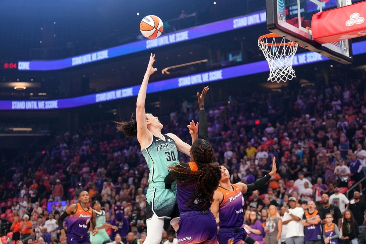 Sep 19, 2025; Phoenix, Arizona, USA; New York Liberty forward Breanna Stewart (30) shoots over Phoenix Mercury forward Natasha Mack (4) during the first half of game three of round one for the 2025 WNBA Playoffs at PHX Arena. Mandatory Credit: Joe Camporeale-Imagn Images
