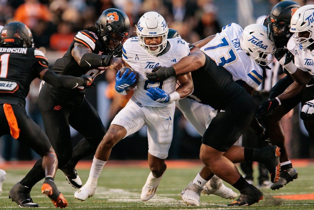 Sep 19, 2025; Stillwater, Oklahoma, USA;  Tulsa Golden Hurricane running back Dominic Richardson (21) runs the ball during the first half against the Oklahoma State Cowboys at Boone Pickens Stadium. Mandatory Credit: William Purnell-Imagn Images