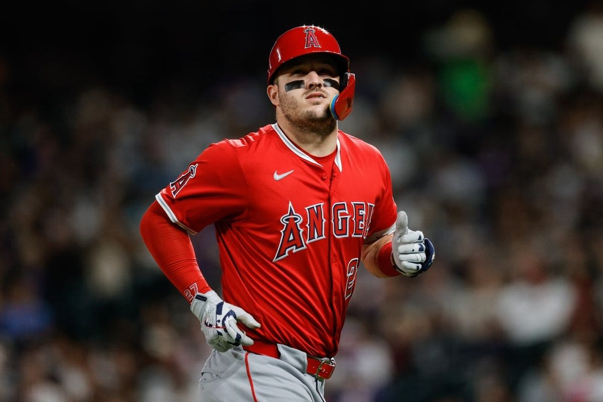 Sep 19, 2025; Denver, Colorado, USA; Los Angeles Angels designated hitter Mike Trout (27) jogs to the dugout after a pop up out in the fifth inning against the Colorado Rockies at Coors Field. Mandatory Credit: Isaiah J. Downing-Imagn Images