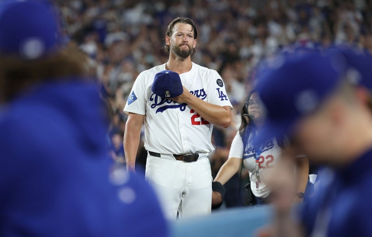 Sep 19, 2025; Los Angeles, California, USA; Los Angeles Dodgers pitcher Clayton Kershaw (22) salutes the crowd after being relieved during the fifth inning against the San Francisco Giants at Dodger Stadium. Mandatory Credit: Kiyoshi Mio-Imagn Images