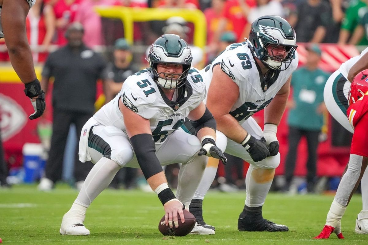 Sep 14, 2025; Kansas City, Missouri, USA; Philadelphia Eagles center Cam Jurgens (51) and guard Landon Dickerson (69) at the line of scrimmage against the Kansas City Chiefs during the second half of the game at GEHA Field at Arrowhead Stadium. Mandatory Credit: Denny Medley-Imagn Images