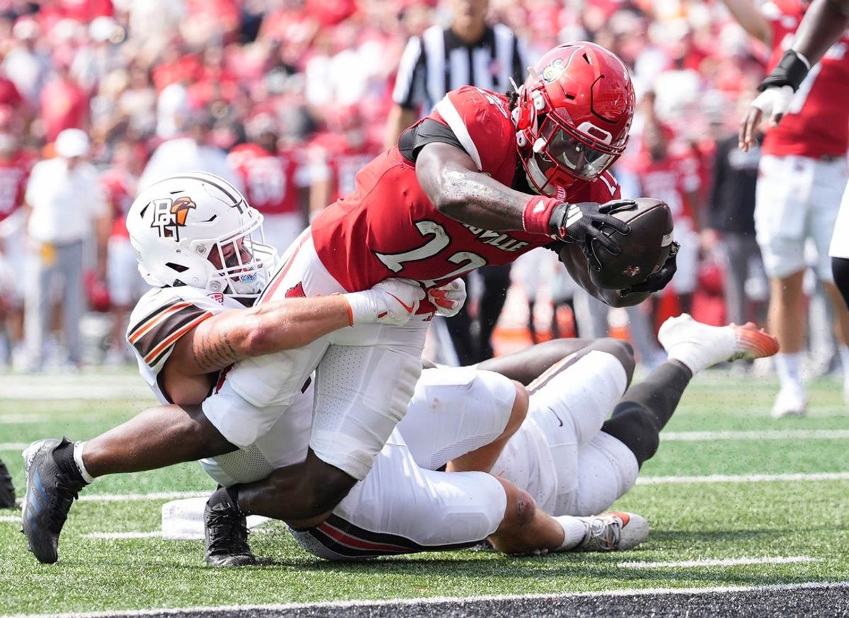 Louisville Cardinals running back Keyjuan Brown (22) lunges towards the endzone for a Cardinals touchdown in the first quarter against Bowling Green at L&N Federal Credit Union Stadium in Louisville, Kentucky Sept. 20, 2025.