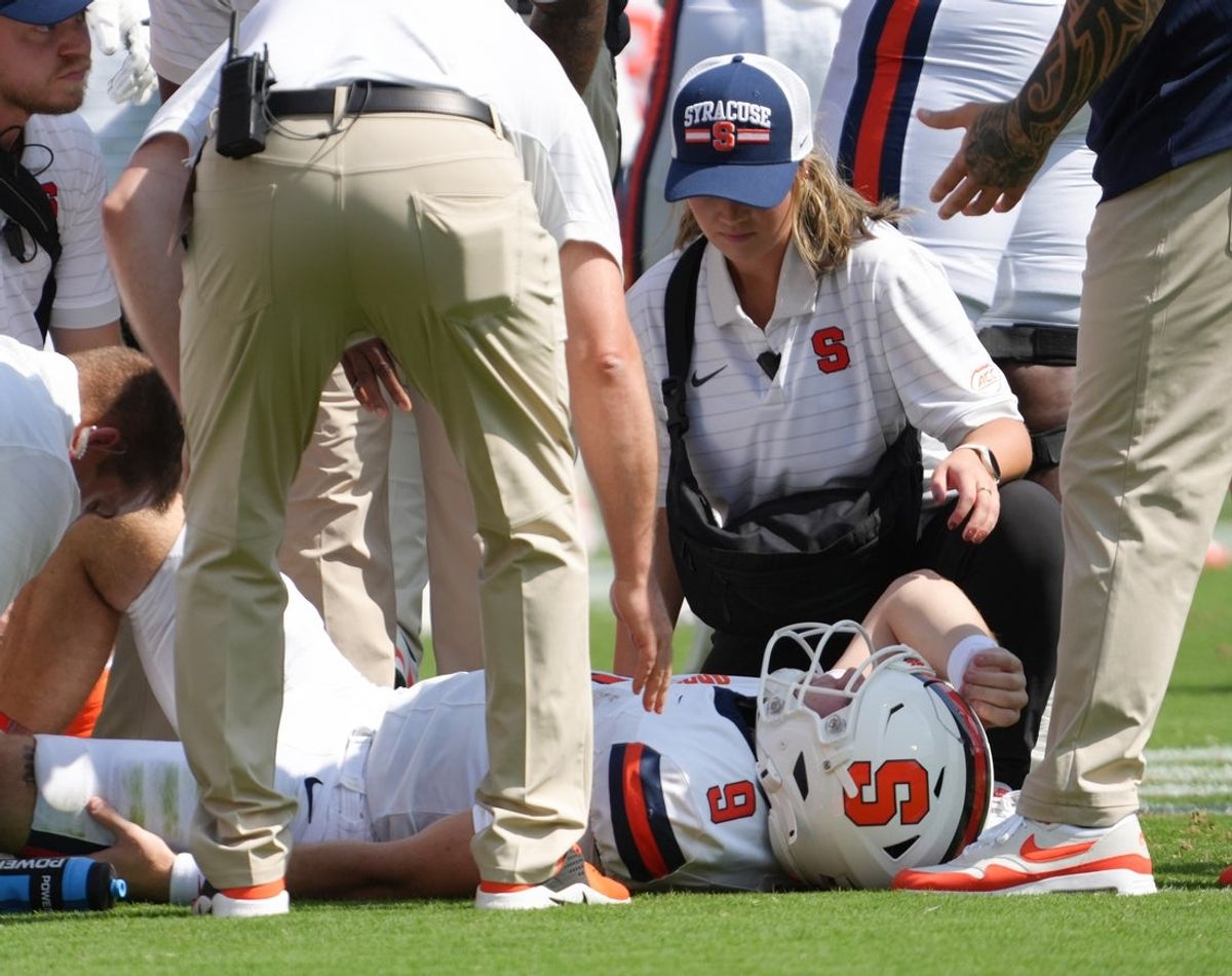 Sep 20, 2025; Clemson, South Carolina, USA; Syracuse Orange quarterback Steve Angeli (9) is checked out after being knocked down by the Clemson Tigers during the first quarter at Memorial Stadium. Mandatory Credit: Ken Ruinard/GREENVILLE NEWS-USA TODAY Network via Imagn Images