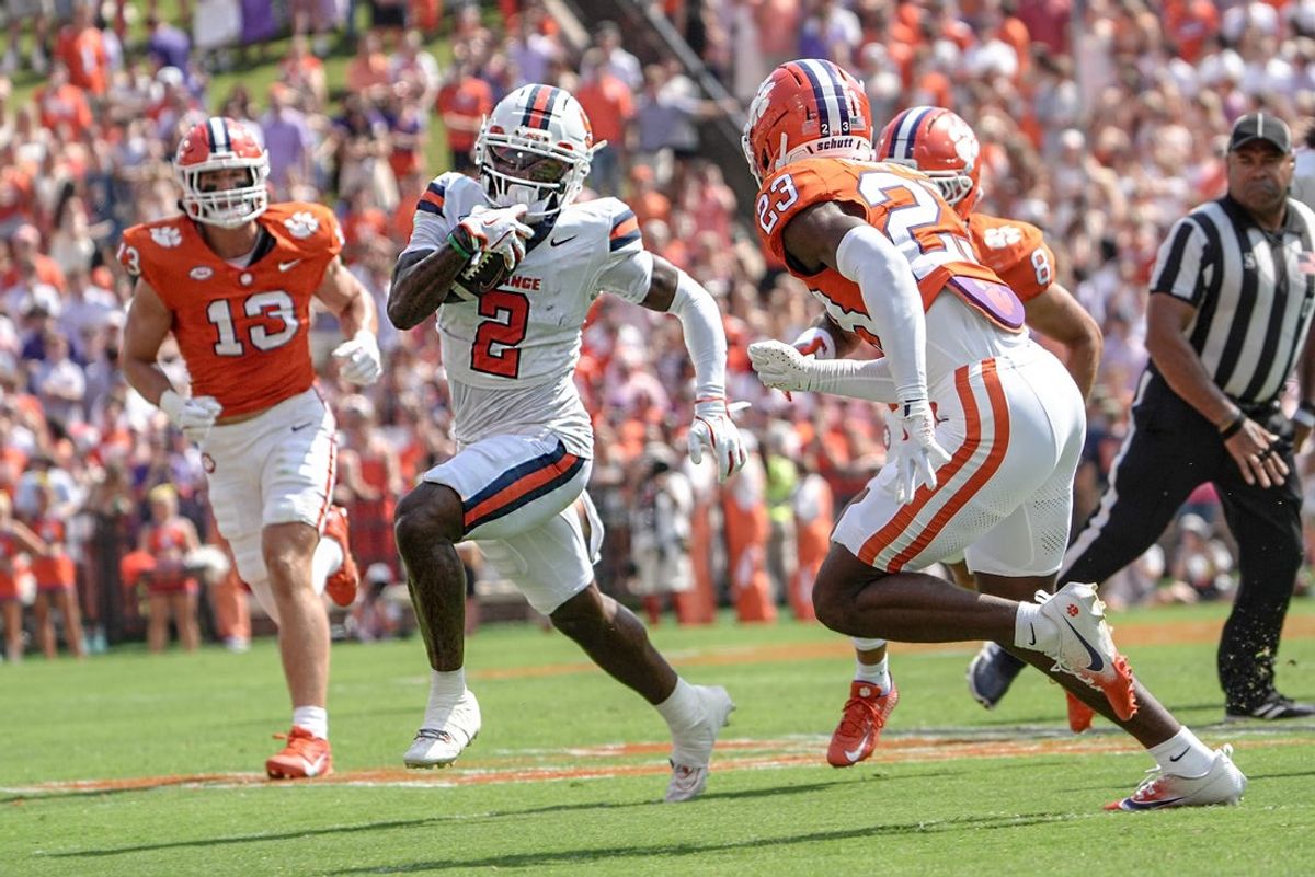 Sep 20, 2025; Clemson, South Carolina, USA; Syracuse Orange wide receiver Johnny Cook (2) runs near Clemson Tigers cornerback Ashton Hampton (23) during the first quarter at Memorial Stadium. Mandatory Credit: Ken Ruinard/GREENVILLE NEWS-USA TODAY Network via Imagn Images