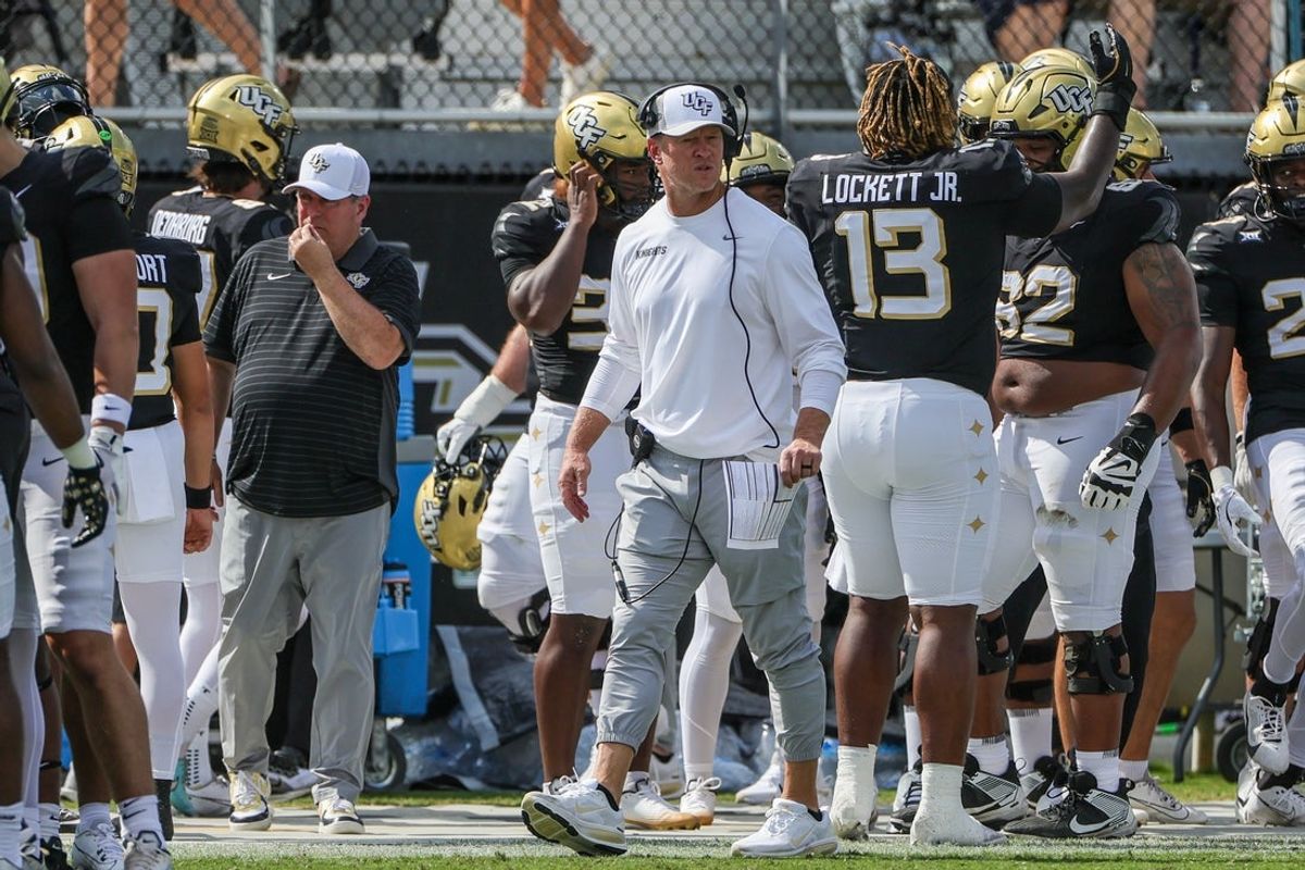 Sep 20, 2025; Orlando, Florida, USA; UCF Knights head coach Scott Frost looks on during the first quarter against the North Carolina Tar Heels at the Bounce House Stadium. Mandatory Credit: Mike Watters-Imagn Images