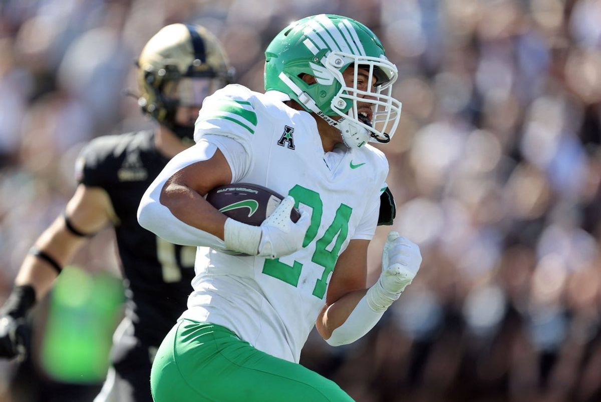 Sep 20, 2025; West Point, New York, USA; North Texas Mean Green running back Caleb Hawkins (24) runs for a touchdown against the Army Black Knights during the second half at Michie Stadium. Mandatory Credit: Danny Wild-Imagn Images