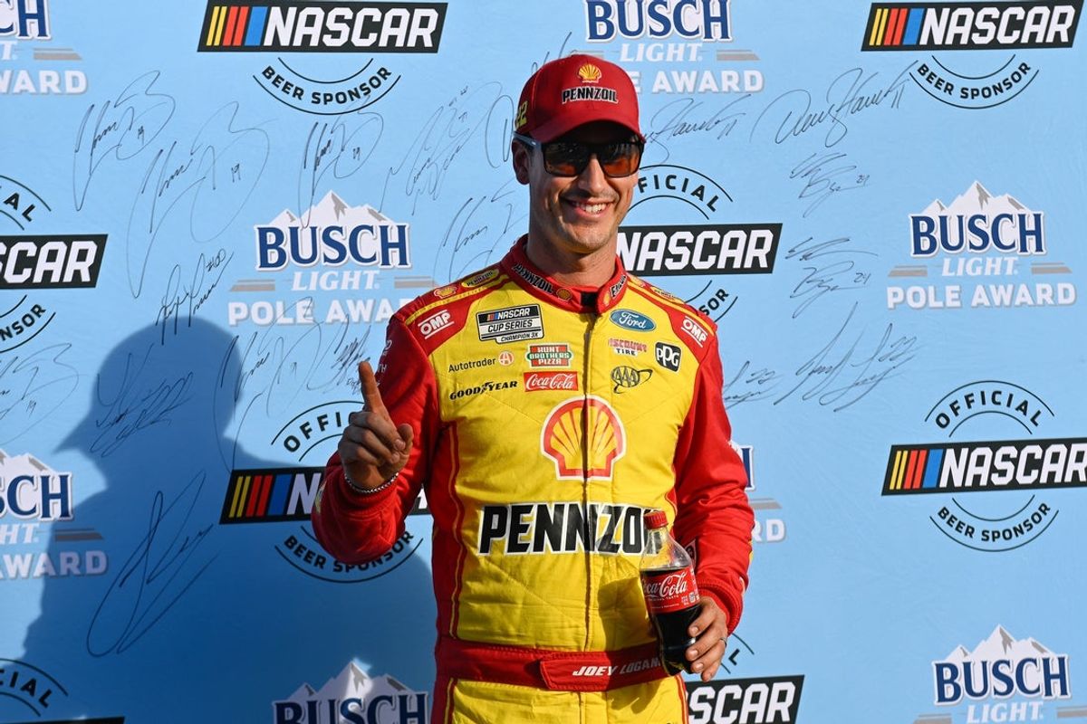 Sep 20, 2025; Loudon, New Hampshire, USA; NASCAR Cup Series driver Joey Logano (22) celebrates winning the starting pole position for the the Mobil 1 301 at New Hampshire Motor Speedway. Mandatory Credit: Eric Canha-Imagn Images