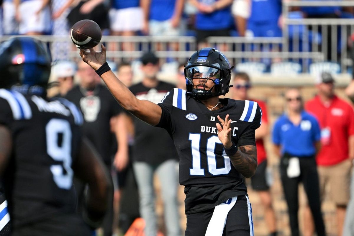 Sep 20, 2025; Durham, North Carolina, USA;  Duke Blue Devils quarter back Darian Mensah (10) throws the ball during the first quarter against the NC State Wolfpack at Wallace Wade Stadium. Mandatory Credit: Zachary Taft-Imagn Images