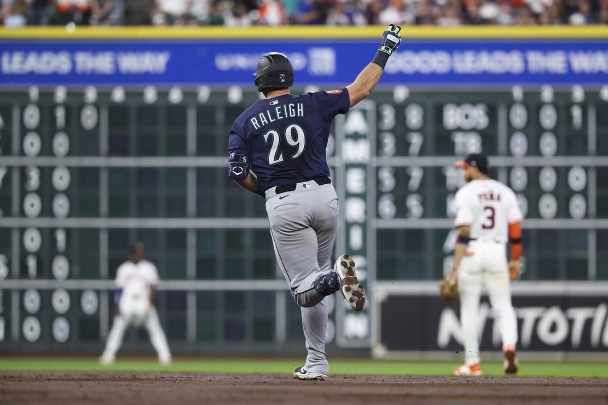 Sep 20, 2025; Houston, Texas, USA; Seattle Mariners catcher Cal Raleigh (29) rounds the bases after hitting a home run during the third inning against the Houston Astros at Daikin Park. Mandatory Credit: Troy Taormina-Imagn Images