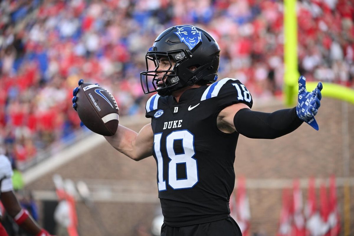 Sep 20, 2025; Durham, North Carolina, USA;  Duke Blue Devils wide receiver Cooper Barkate (18) celebrates a touchdown during the third quarter against the NC State Wolfpack at Wallace Wade Stadium. Mandatory Credit: Zachary Taft-Imagn Images