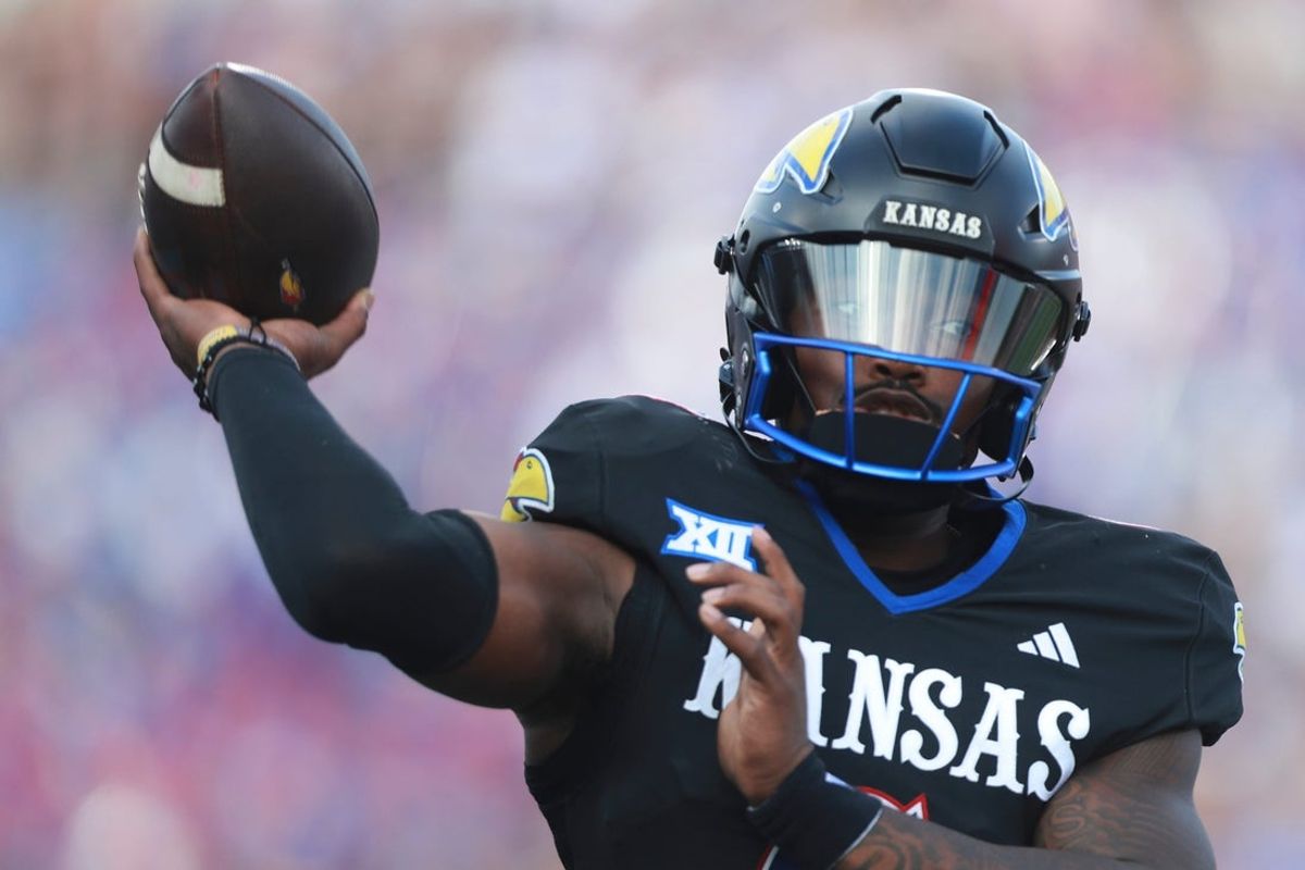 Kansas Jayhawks quarterback Jalon Daniels (6) throws a pass during the first half of the game against West Virginia Mountaineers at David Booth Kansas Memorial Stadium on Sept. 20, 2025.