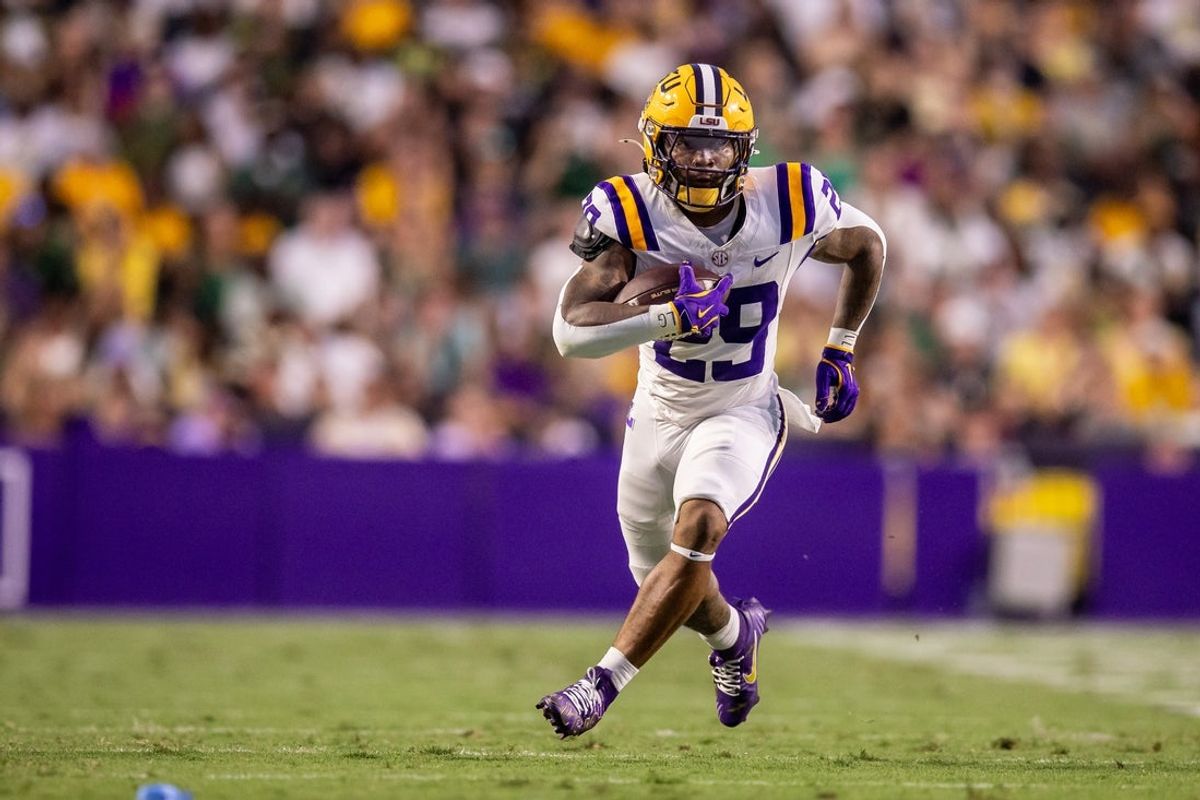 Sep 20, 2025; Baton Rouge, Louisiana, USA;  LSU Tigers running back Caden Durham (29) runs against the Southeastern Louisiana Lions during the first half at Tiger Stadium. Mandatory Credit: Stephen Lew-Imagn Images