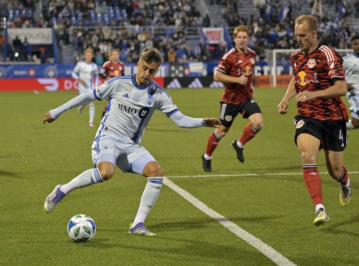 Sep 20, 2025; Montreal, Province of Quebec, CAN; CF Montreal forward Ivan Jaime (11) plays the ball and New York Red Bulls midfielder Gustav Berggren (4) defends during the first half at Saputo Stadium. Mandatory Credit: Eric Bolte-Imagn Images