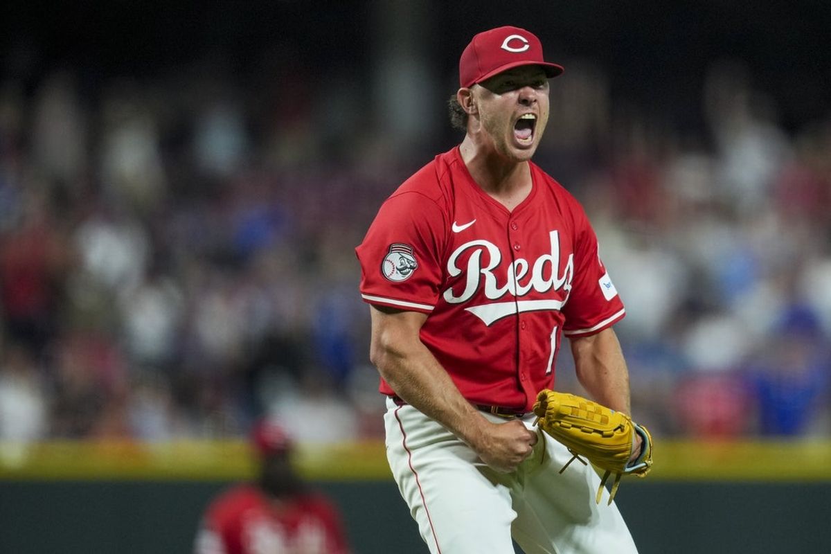 Sep 20, 2025; Cincinnati, Ohio, USA; Cincinnati Reds pitcher Emilio Pagan (15) reacts after the final out of the game against the Chicago Cubs at Great American Ball Park. Mandatory Credit: Aaron Doster-Imagn Images