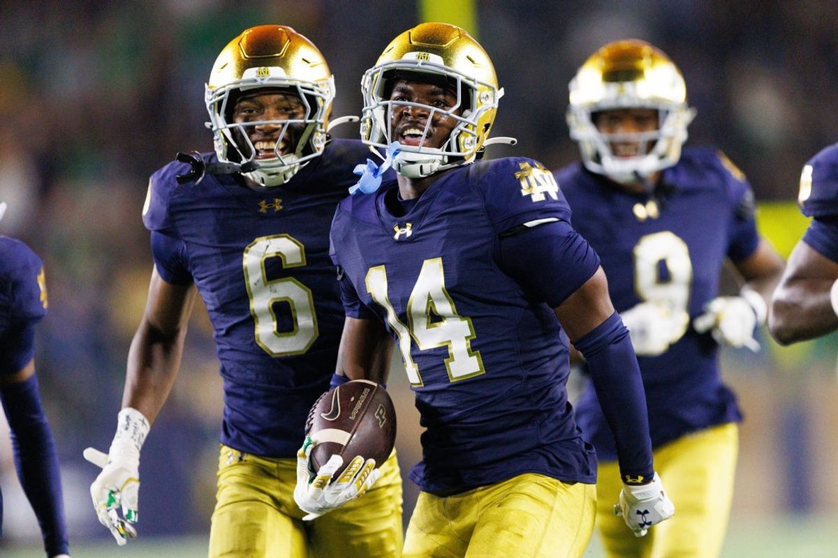 Notre Dame cornerback Dallas Golden (14) celebrates after intercepting a pass during the second half of a NCAA football game against Purdue at Notre Dame Stadium on Saturday, Sept. 20, 2025, in South Bend.