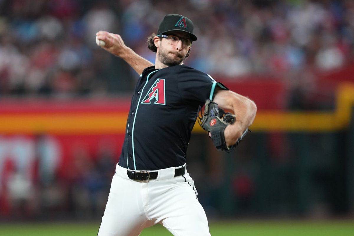 Sep 20, 2025; Phoenix, Arizona, USA; Arizona Diamondbacks pitcher Zac Gallen (23) pitches against the Philadelphia Phillies during the third inning at Chase Field. Mandatory Credit: Joe Camporeale-Imagn Images