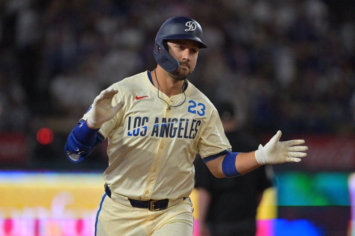 Sep 20, 2025; Los Angeles, California, USA; Los Angeles Dodgers outfielder Michael Conforto (23) reacts after scoring a run during the third inning against the San Francisco Giants at Dodger Stadium. Mandatory Credit: Jayne Kamin-Oncea-Imagn Images