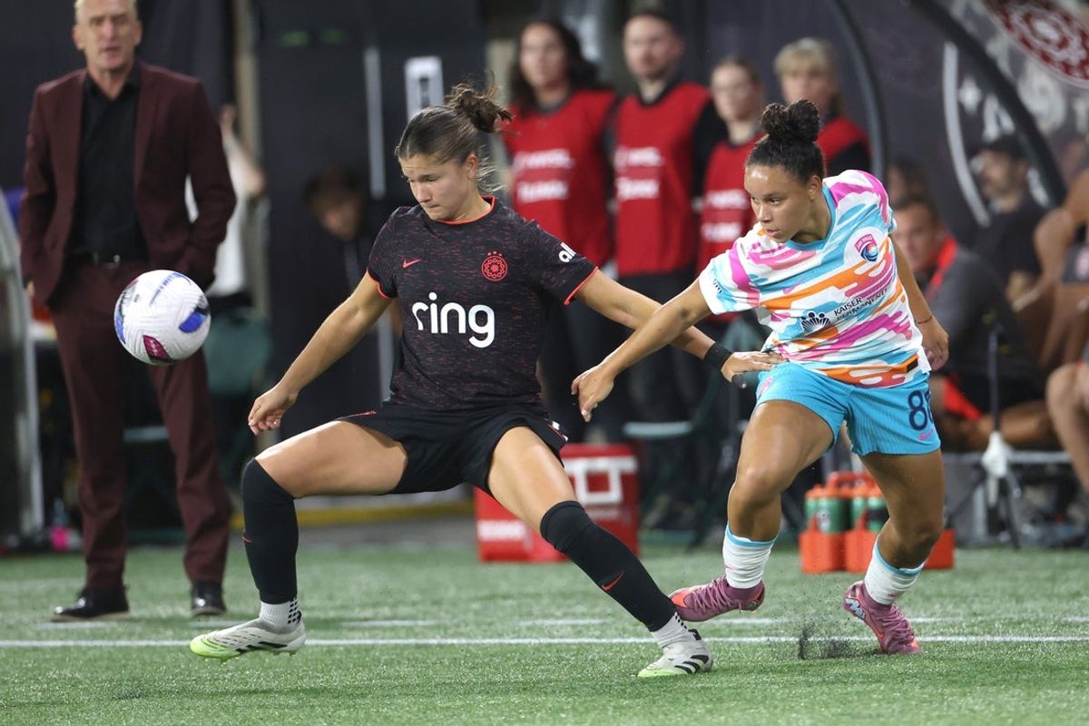 Sep 20, 2025; Portland, Oregon, USA;  Portland Thorns FC forward Deyna Castellanos (10) kicks the ball away from San Diego Wave FC midfielder Maria Eduarda Rodrigues Silva (88) in the first half at Providence Park. Mandatory Credit: Jaime Valdez-Imagn Images