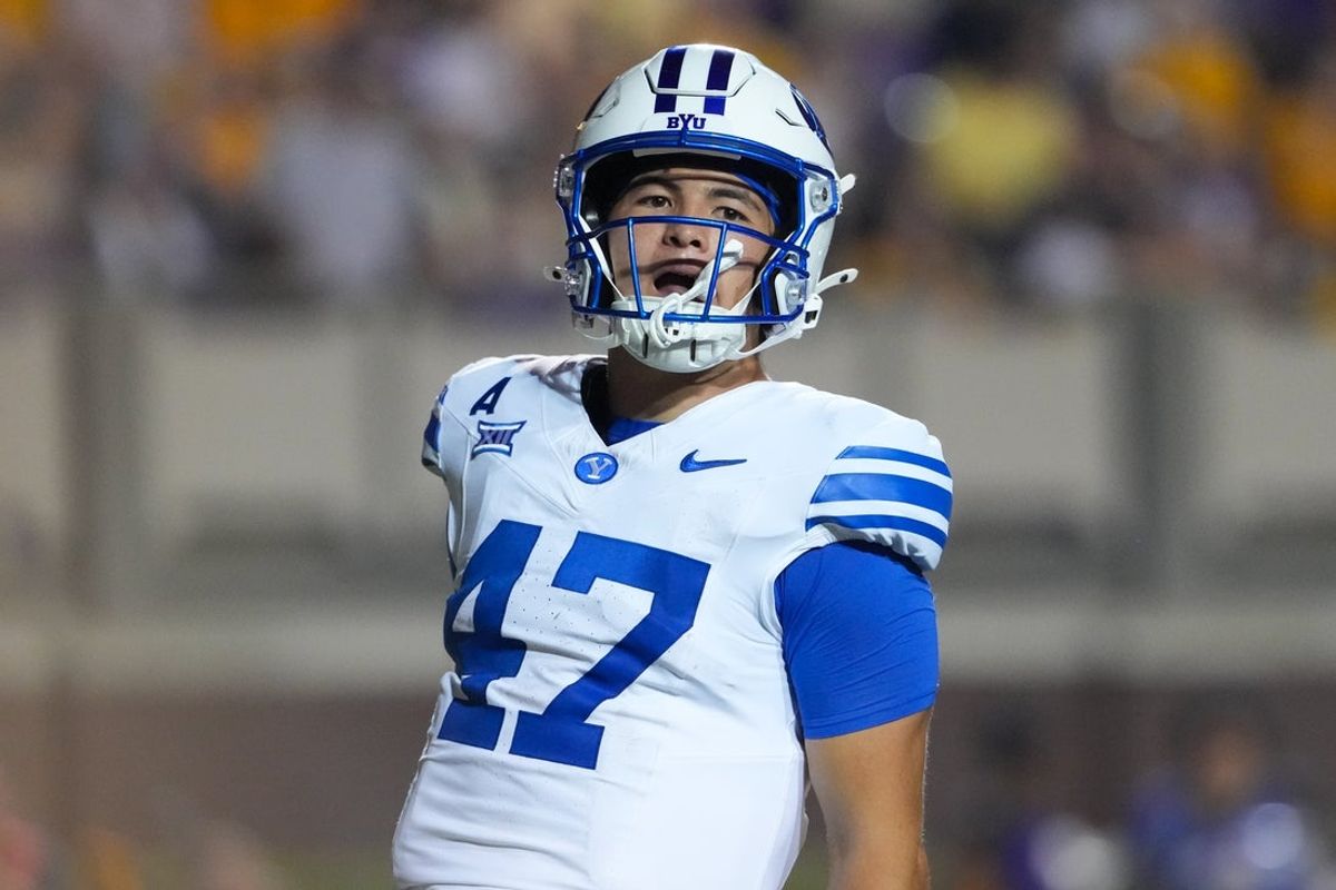 Sep 20, 2025; Greenville, North Carolina, USA;  Brigham Young Cougars quarterback Bear Bachmeier (47) runs for a touchdown against the East Carolina Pirates during the second half at Dowdy-Ficklen Stadium. Mandatory Credit: James Guillory-Imagn Images