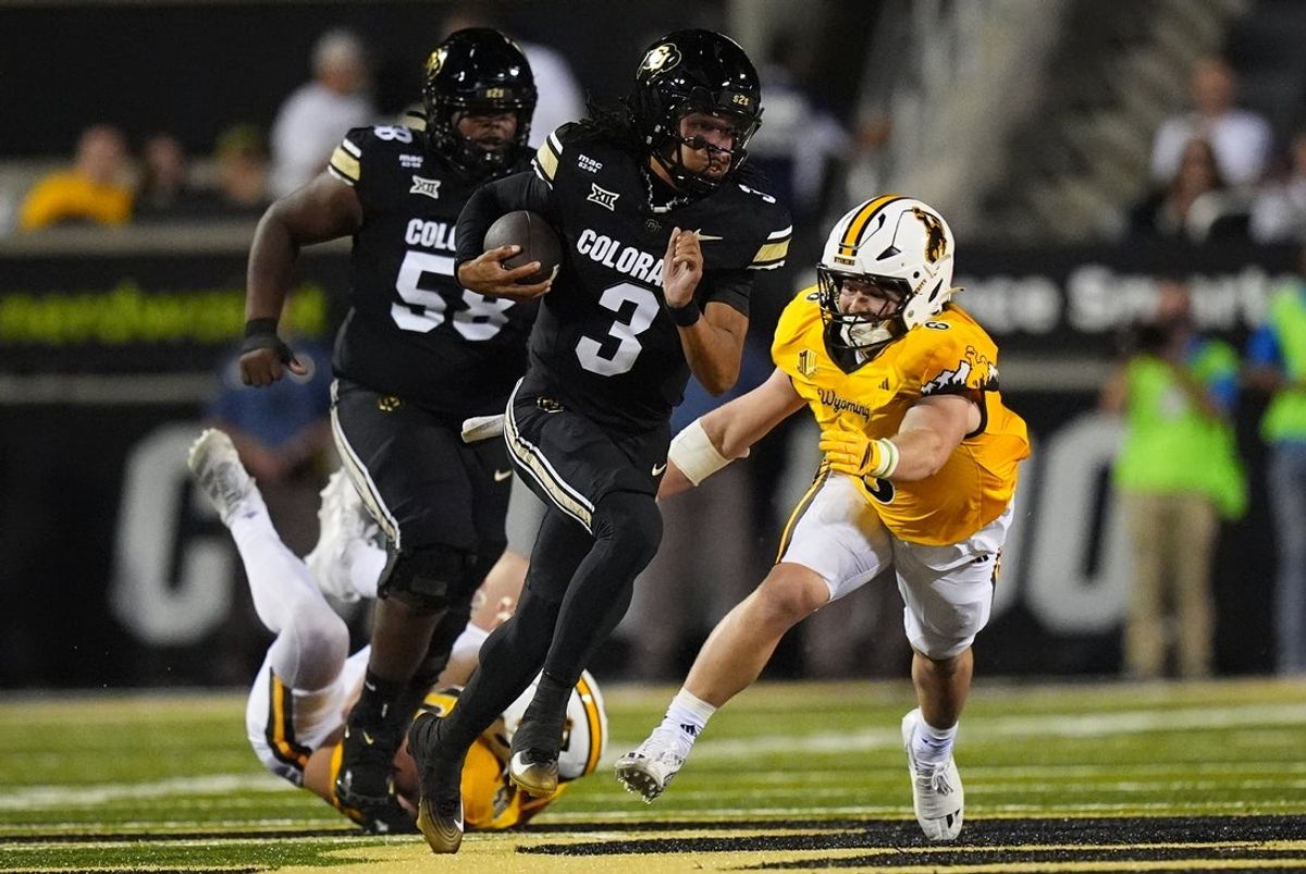 Sep 20, 2025; Boulder, Colorado, USA; Colorado Buffaloes quarterback Kaidon Salter (3) scrambles with the ball as Wyoming Cowboys linebacker Evan Eller (6) chases in first quarter at Folsom Field. Mandatory Credit: Ron Chenoy-Imagn Images